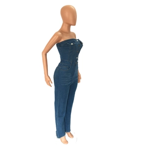 Detail view of deep blue denim tube top jumpsuit with front buttons and side pockets