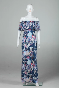 Close-up of floral print off-shoulder neckline with ruffled bohemian maxi dress detail