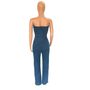 Detail view of the back of blue denim tube jumpsuit with pockets and frayed hems