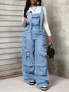 Detailed full view of light blue denim overalls with large utility cargo pockets and wide legs