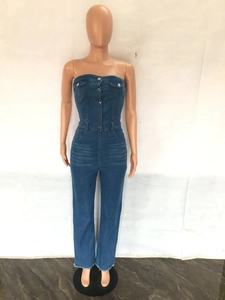 Close-up of the strapless denim jumpsuit featuring front buttons and flap pockets