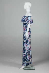 Detail of off-shoulder neckline with ruffled trim on a navy floral maxi dress