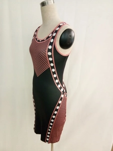 Elegant sleeveless bodycon dress with geometric pink stripes and white polka dot pattern