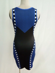 Detail of slim-fit sleeveless dress with blue geometric stripes and white polka dots