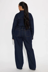 Detailed back view of dark indigo denim jumpsuit with elastic waist and contrast stitching