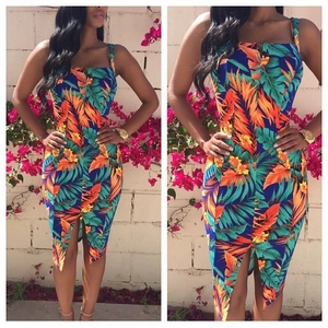 Detail of square neck tropical floral dress with side slit and palm leaf print pattern