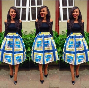 Women's two-piece set featuring a black off-shoulder top and a vintage print midi skirt