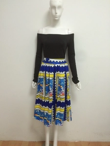 Women's two-piece set featuring a black off-shoulder top and stamp-print pleated midi skirt