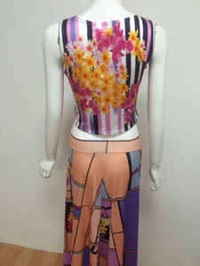 Two-piece floral print set with crop tank top and high-waisted geometric maxi skirt
