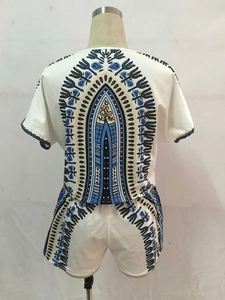 Detail of bohemian dashiki print on back of white short sleeve top and shorts set