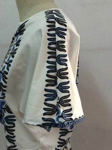 Ethnic print short sleeve white top for women with blue tribal embroidery on shoulders