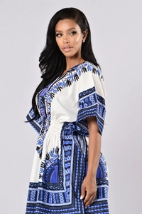 Detail of V-neckline and ethnic geometric pattern on a dashiki style dress