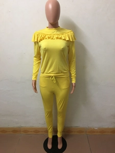 Detail of ruffle trim on yellow two-piece lounge set with drawstring waist pants