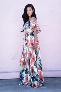 Detail of off-shoulder floral maxi dress with ruffle trim and waist tie detail