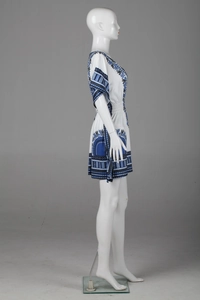 Detail view of Bohemian floral print dress with V-neckline and ruffled waist on mannequin