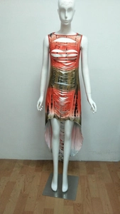 Detail of artistic tie-dye dress featuring intricate hollow-out cutwork and irregular hemline