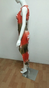 Detail of orange and olive green tie-dye dress with hollow cut-out fringe design