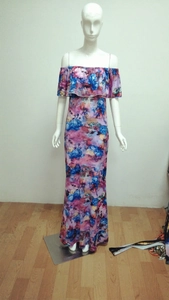 Detailed view of off-shoulder floral maxi dress with ruffle neckline and slim fit