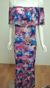 Detail of off-shoulder ruffled neckline on maxi floral print dress in blue and magenta