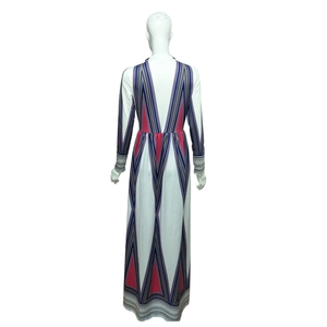 Back view of a floor-length long-sleeve dress featuring colorful V-shape geometric prints
