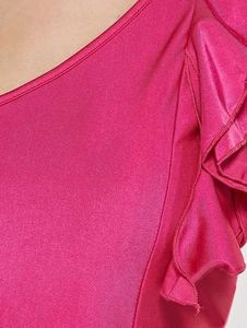 One-shoulder ruffle detail on hot pink bodycon dress with textured metallic fabric