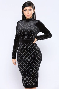 Detail of black velvet dress featuring white rhinestones in a diamond lattice pattern