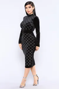 Detailed view of black velvet bodycon dress featuring white rhinestone diamond pattern