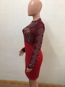 Detailed close-up of rhinestones and mesh patchwork on a long sleeve bodycon dress