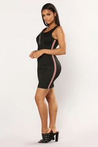 Detail view of the black sporty mini dress featuring side stripes and metal ring zipper