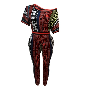 Detailed view of the vibrant Greek Key print on the off-shoulder top and legging set