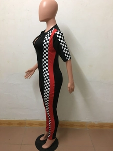 Detail of racing jumpsuit featuring red stripes and checkerboard patterns on side