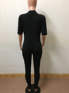 Back view of slim fit black jumpsuit with stand collar and checkered sleeve detail