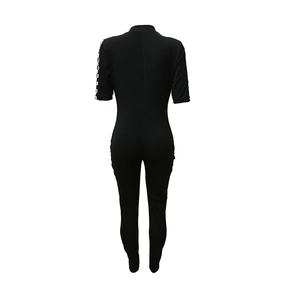 Back view of slim fit black short sleeve romper with checkered racing stripe on sleeve