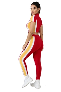 Women's two-piece red sporty tracksuit set with yellow and white side stripe details
