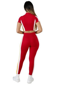 Rear view of women's two-piece tracksuit with contrast color block panels and slim fit design