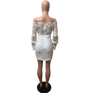 Close-up of the back detail of white lace mini dress with invisible zipper and floral texture