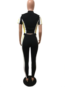 Rear view of two-piece tracksuit featuring color-block windbreaker style on mannequin