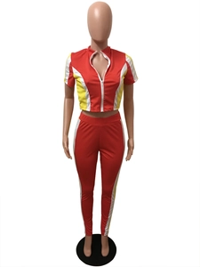 Detailed view of women color block tracksuit set with red yellow white patchwork design