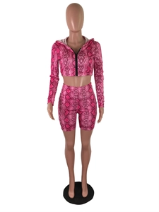 Detail of rose red snake print crop top hoodie with zipper and high waist biker shorts