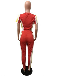 Back view of red two-piece tracksuit with yellow and white side stripe splicing details