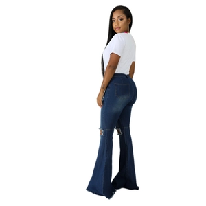 Women's high waist flare jeans with distressed knee holes and frayed hems in dark blue