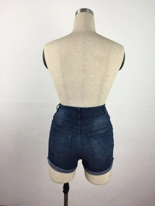 Rear view of high-waist denim shorts featuring vintage wash and fixed rolled cuffs
