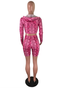 Rear view detail of pink snake print crop top and high waist cycling shorts set