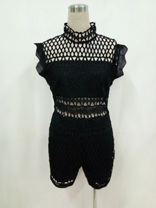 Elegant black hollow crochet romper with high neck and bohemian lace pattern