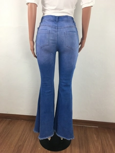 Rear view of light blue flared jeans featuring a vintage frayed hem and back pockets