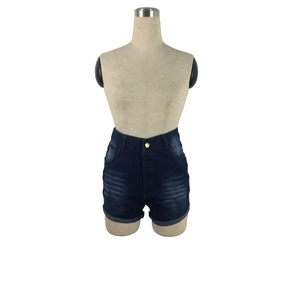Detail of dark blue high-waisted denim shorts with gold buttons and folded hems