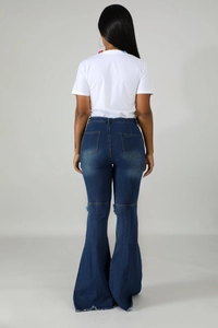 Rear view of dark blue flared jeans with high waist, classic pockets and raw hem