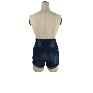 Detailed back view of high waist dark wash denim shorts with rolled hems and pockets