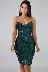 Close-up detail of dark green sequin bodycon dress with elegant gold chain straps