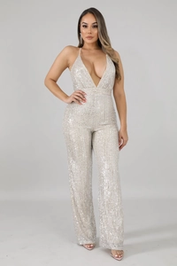 Close-up of sparkling deep V-neck sequined jumpsuit with champagne glitter finish